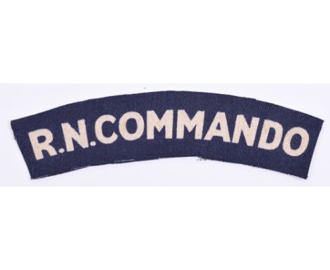 WW2 Royal Naval Commando Printed Shoulder Title, white lettering R.N.COMMANDO on blue backing. 
