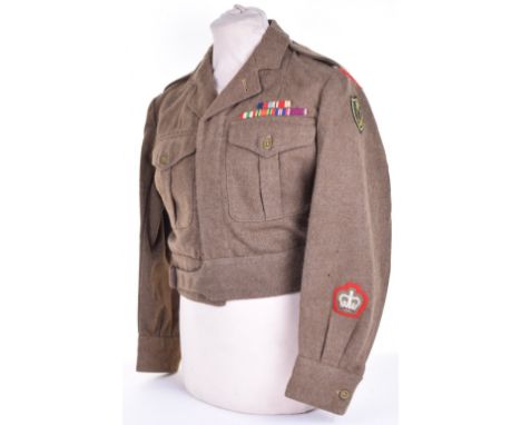 1949 Pattern Royal Military Police Northern Ireland District Warrant Officers Battle Dress Blouse, embroidered black on red s