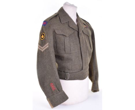 Royal Canadian Ordnance Corps Battle Dress Blouse, 1945 dated Canadian made battle dress blouse with embroidered shoulder tit