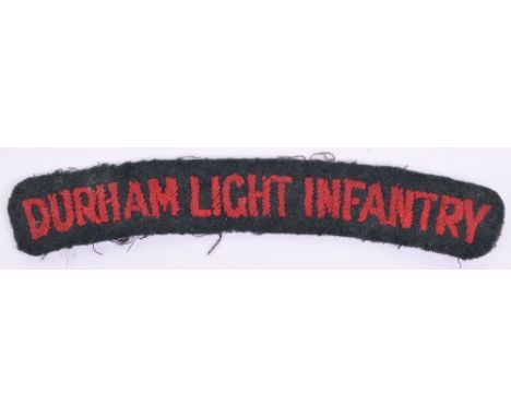 16th Battalion Durham Light Infantry Cloth Shoulder Title, red embroidered lettering on dark green backing cloth. Good condit