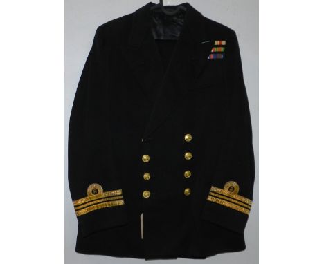 British Navy dress uniform jacket having Gieves of Edinburgh label "2/18471 W D R WILLIAMS 1.7.41" with Gieves brass naval bu