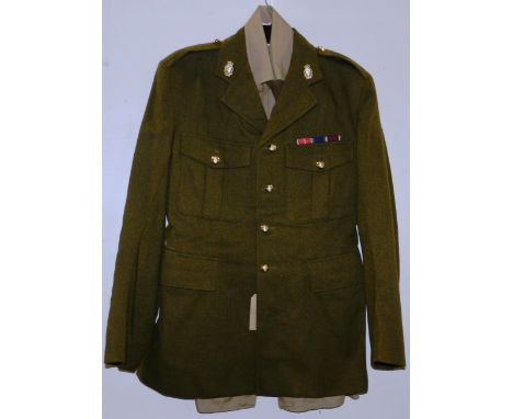 British Army dress uniform khaki green jacket having Edgard and Sons Ltd label with Royal Army Ordnance Corps insignia includ