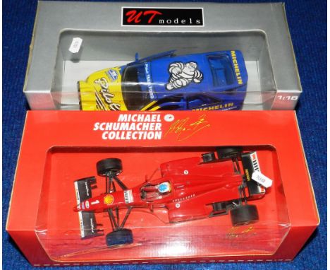 Two 1:18 scale die cast cars. Ferrari F 310, 1996 and Escort RS Cosworth rally car. Both boxed. (2) 