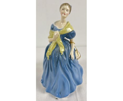 A ceramic figurine of "Adrienne", HN2304 by Royal Doulton. Blue dress and bow to hair with pale green shawl. Approx. 19cm tal