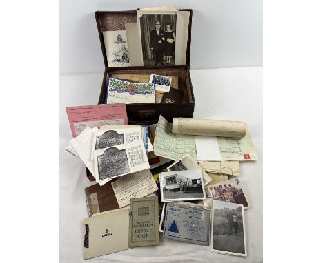 A small vintage brown suitcase of assorted vintage ephemera and photographs. To include WWII army service book &amp; identity