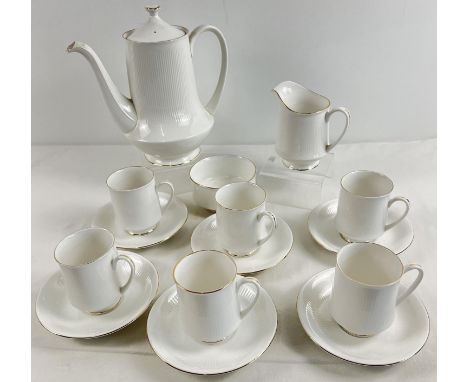 A vintage bone white china coffee set by Royal Standard, with gold rim detail. Comprising: 6 coffee cup and saucers, sugar bo