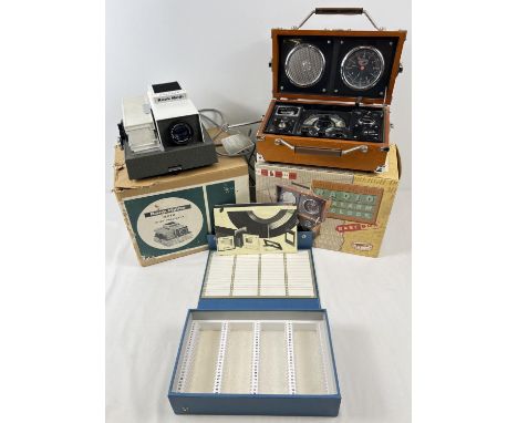 A boxed vintage Rank Hylite Moth Slide Projector with a vintage slide box. Together with a boxed Avionic adventure "Spirit Of