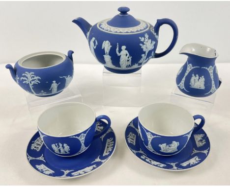 A 19th century Wedgwood Portland blue Jasperware dipped tea for two set. Comprising: lidded teapot, 2 handled sugar pot (lid 