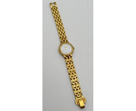 A ladies Citizen Eco-Drive wristwatch with gold plated stainless steel strap, white ceramic face and gold tone hour markers a