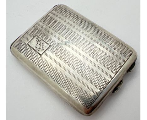 A small Art Deco silver cigarette case with engine turned decoration front &amp; back. Engraved monogram to rectangular carto