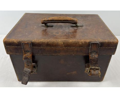 A small vintage leather carry case/trunk with green felt lining and name badge to inside of lid. Label reads " o'G. &amp; C-H