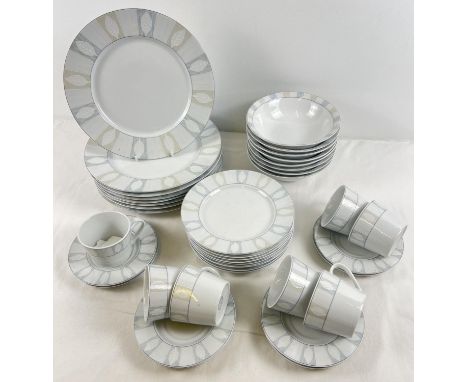 A collection of dinner ware by Studio Concept with leaf decoration. Comprising: 8 saucers, 7 cups, 8 bowls, 8 dinner plates a