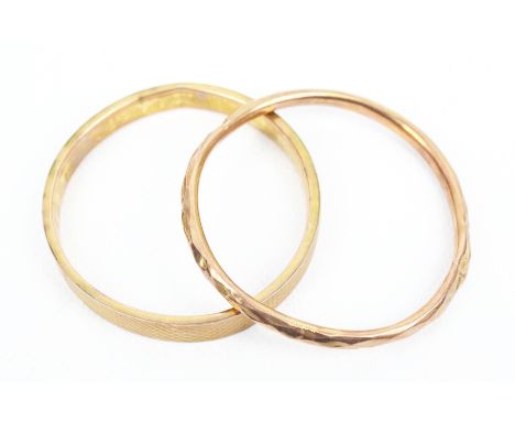 Two early 20th century 9ct rose gold slave bangles. Comprising: an engine-turned rectangular-section slave bangle, hallmarks 
