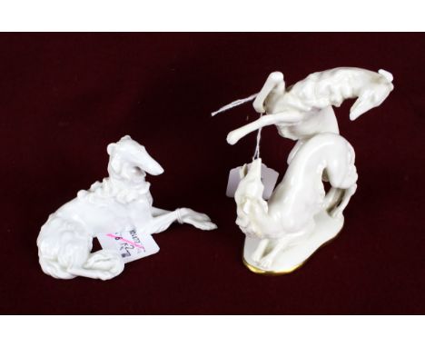 Two continental porcelain figures of dogs. Comprising an Austrian glazed porcelain figure of a seated wolfhound, L12cm and a 