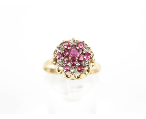 A vintage 9ct gold, ruby and diamond cluster ring. Hallmarks for Birmingham 1972