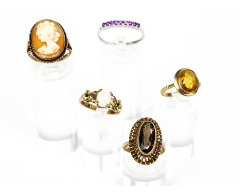 A collection of five vintage 9ct gold and gem-set rings. Comprising: an oval cabochon white opal single stone ring, size L+; 