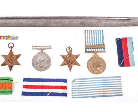 Medals: Three WWII medals, 39-45, two further medals and a bayonet. Comprising the Defense Medal, The France and Germany Star