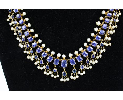 An early 20th century sapphire and cultured-pearl fringe necklace in Indian style. In the form of 25 graduated cushion-shaped