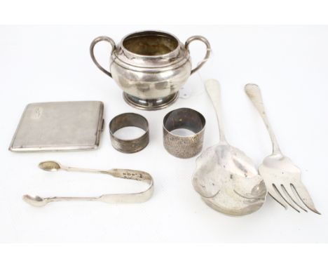 A small collection of silver including a round two-handled sugar bowl on foot. Mark of Atkin Bros., Sheffield 1933; a Victori