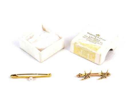 Two early 20th century gold brooches including one in the form of two swifts set with half-pearls. The other a plain bar cent