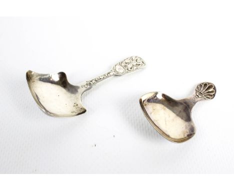 Two silver caddy spoons. Comprising a Victorian fiddle pattern caddy spoon with a foliate engraved handle, mark of George Uni
