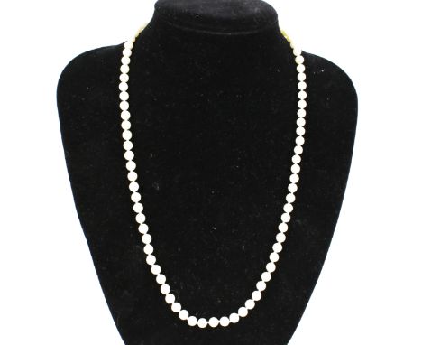 A cultured pearl single row necklace. The 5.7mm-6.0mm diameter beads knotted on an oval clasp stamped '375', 57cm long overal