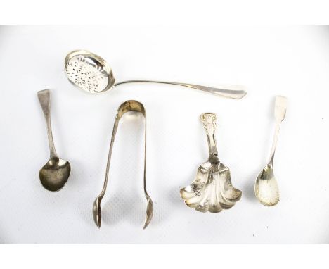 A late Victorian crested silver rat tail sifter spoon, three small spoons and a sugar tong. The sifter spoon with an indistin