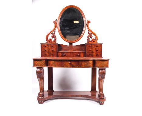 A Victorian Duchess mahogany dressing table. Shaped front with cabriole supports and an oval mirror, H150cm x W120cm x D51.5c