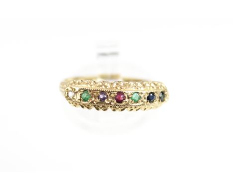 A modern 9ct gold and multi-gem 'Dearest' ring. The small round stones comprising Diamond, Emerald, Amethyst, Ruby, Emerald, 