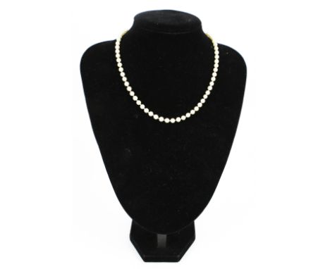 A vintage cultured pearl single row necklace. The 5.1mm-5.5mm diameter beads knotted on a fluted-spherical clasp with import 