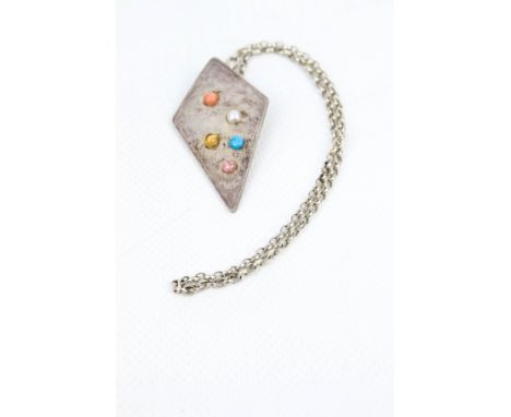 A modern Britannia standard silver and gem set lozenge-shaped pendant and a silver chain. The kite-shaped pendant engraved wi
