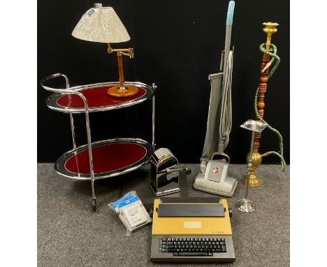 A 1970’s chromed metal and glass tea trolley;  adjustable table lamp;  Brother electronic typewriter, model CE-30;  floor-sta