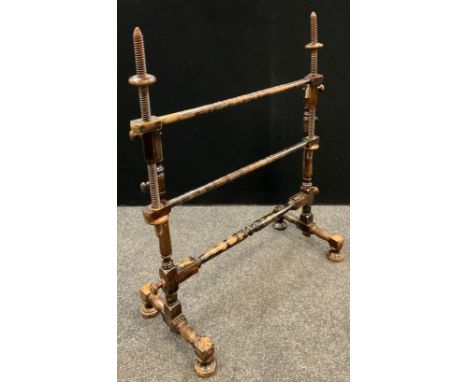 A late 19th/early 20th century tapestry/embroidery stand, adjustable arms, turned columns, stretcher and feet, 110cm high, 92