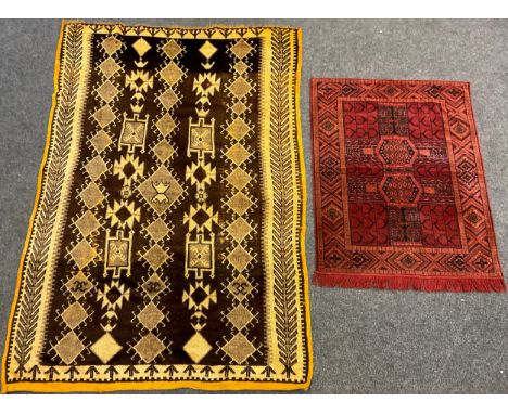 A North African hand-knotted rug, in tones of brown and cream, narrow ochre yellow coloured margin, 244cm x 152cm;  a small M