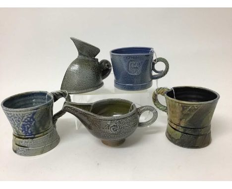 Five salt glazed studio pottery items including Mark Compton jug, 11cm high, two Jane Hamlyn mugs, both 9cm high, another 7.5