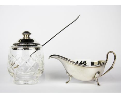 A hallmarked silver topped cut glass pickle jar with silver pickle fork and hallmarked silver sauce ladle. Total weight - app