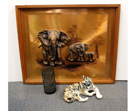 A large South African framed copper picture of elephants together with a glass vase and a Russian ceramic tiger, picture size