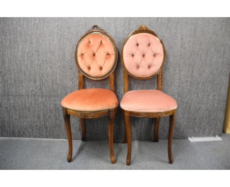 Two button backed boudoir chairs.