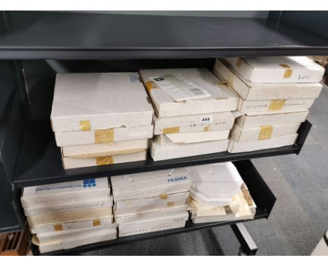 A quantity of boxed collectors plates.