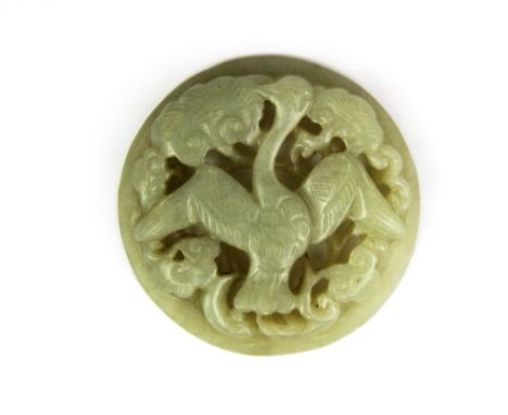 A 19th / 20th Century Chinese carved celadon jade panel of a phoenix in clouds, Dia. 5.5.cm.