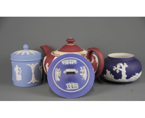 An unusual red Wedgwood teapot together with a Wedgwood box and cover and an Adams bowl with an additional pate sur pate lid,