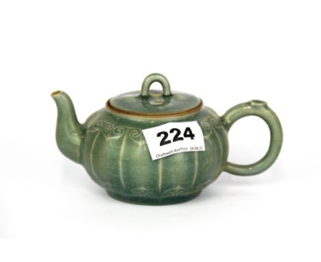 A Chinese celadon glazed teapot, L. 15cm.