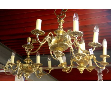 Three gilt brass six branch chandelier light fittings with three matching wall lights, chandelier W. 55cm.