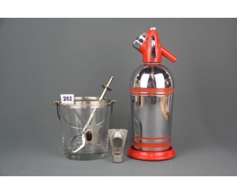 A vintage chrome plated syphon with an ice bucket and tongs.