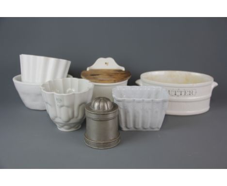 Four early ceramic jelly moulds together with a 19th Century pewter half pint ice cream mould, H. 11.5cm, with a butter dish 