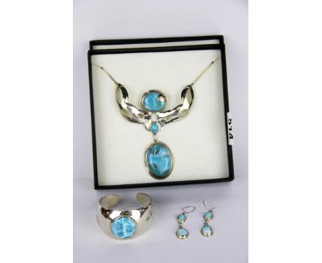 A boxed set of sterling silver necklace, bangle and earrings set with larimar.