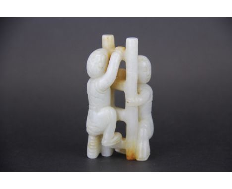 A 19th / early 20th Century Chinese carved white and russet jade figure of two boys climbing a ladder, H. 8cm.