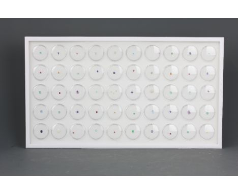 A tray containing a variety of unmounted mixed semi-precious stones including sapphire, amethyst, citrine, diamond, emerald, 