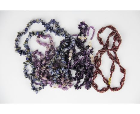 A quantity of garnet, amethyst and lapis necklaces.