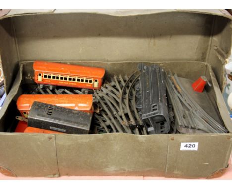 A Lionel 027 "0" gauge clockwork electric railway set  with rail track, engine, tender and three carriages.